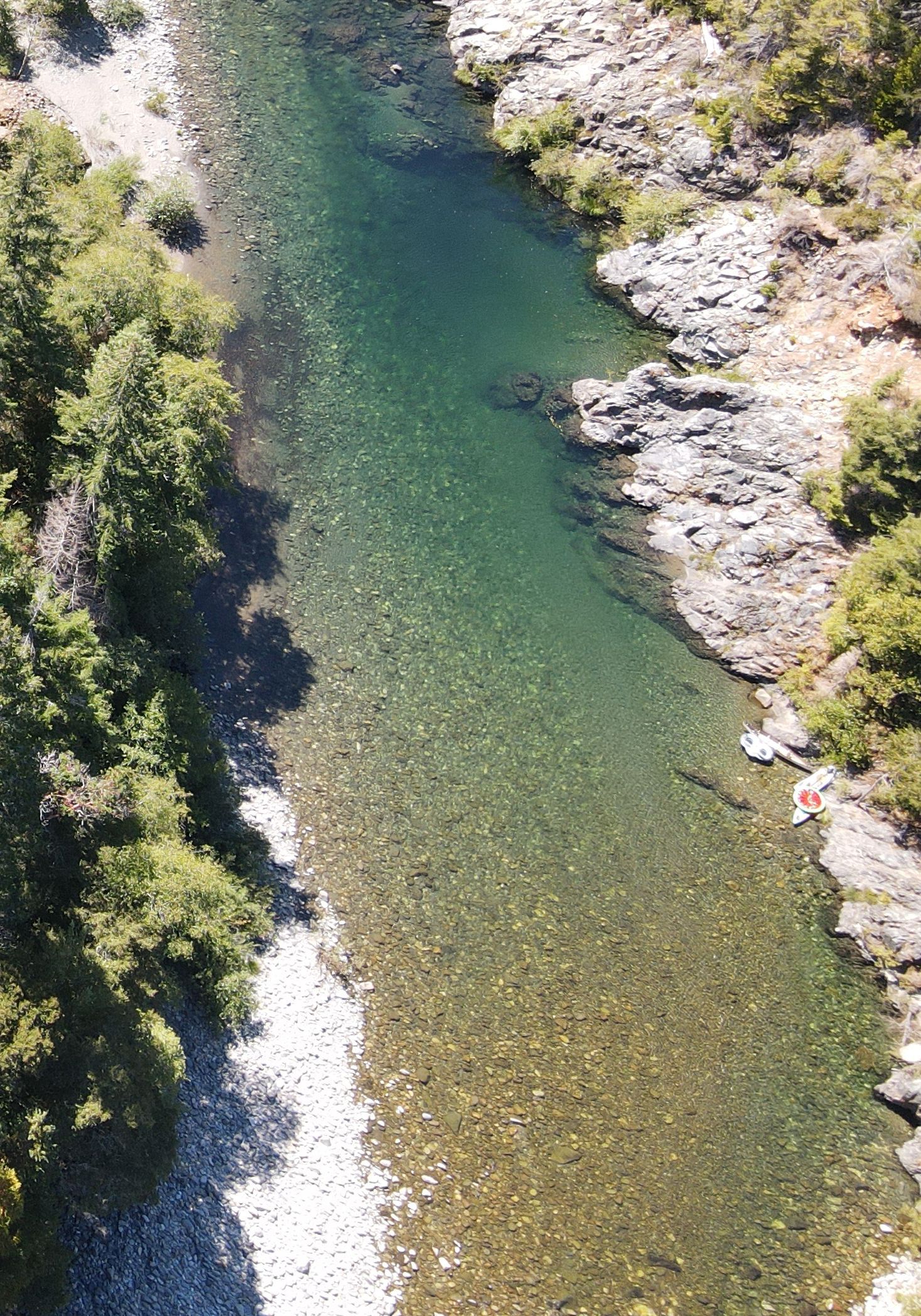 Aerial photograph of a river reach entirely of small cobble and gravel, with very clear water and no apparent cover for escaping from predators.