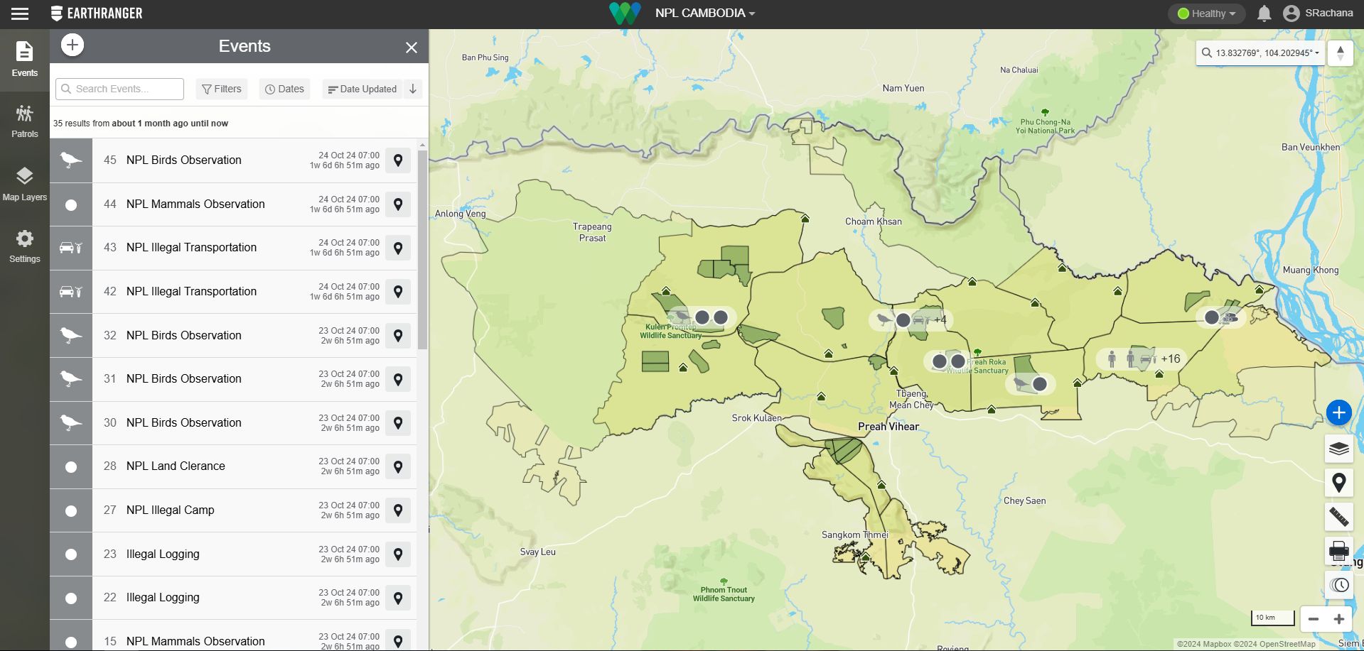 Map interface from the EarthRanger platform showing event data in northeastern Cambodia, specifically around the Preah Vihear region. The left panel lists various events like bird and mammal observations, illegal transportation, logging, and land clearance, each labeled with a timestamp and location icon. The main map highlights protected areas such as Kulen Promtep and Preah Roka Wildlife Sanctuaries, overlaid with icons representing event categories and densities. The interface includes navigational tools, a search bar, and user information in the top right corner. Credit Wildlife Conservation Society-Cambodia Program.