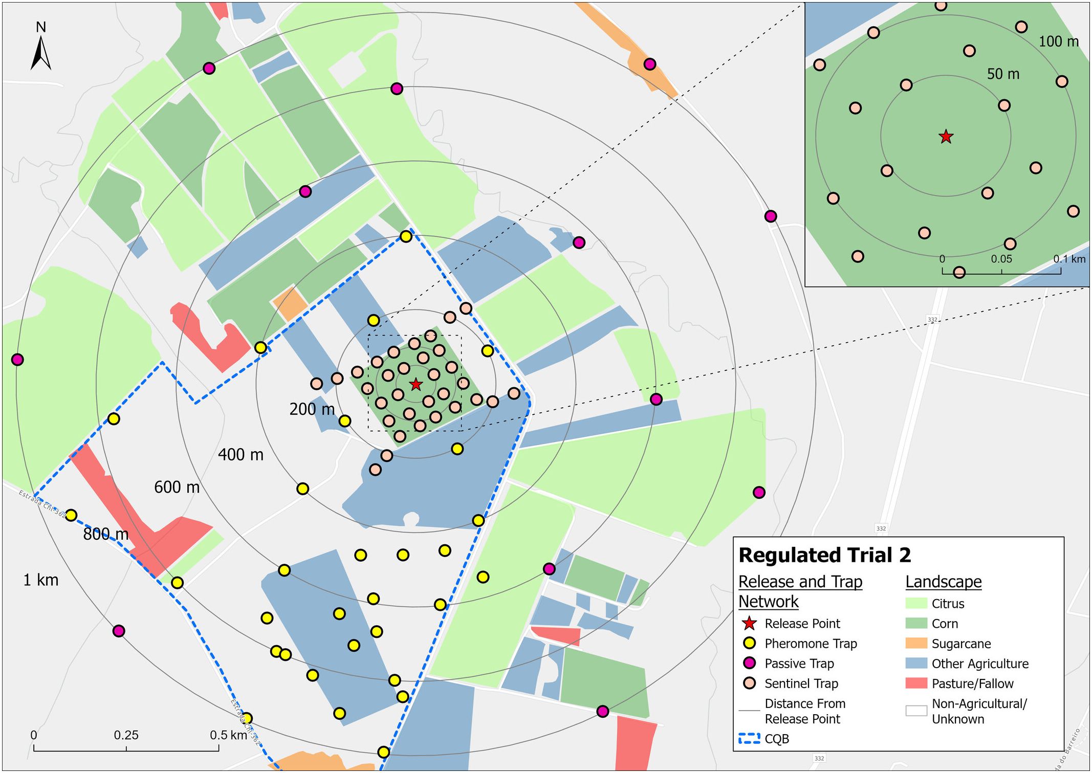 Map titled âRegulated Trial 2â shows a release and trap network in a landscape. Legends indicate release point, pheromone trap, passive trap, and sentinel trap. Colored areas represent citrus, corn, sugarcane, other agriculture, pasture/fallow, and non-agricultural/unknown land. Concentric circles show distances from the release point. Inset map highlights the release area with distances marked.