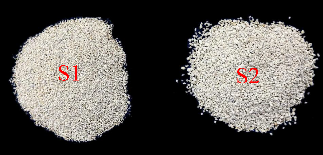 Two piles of granular material labeled S1 and S2 on a black background. S1, on the left, appears finer and more uniform. S2, on the right, appears coarser and slightly more irregular in texture.