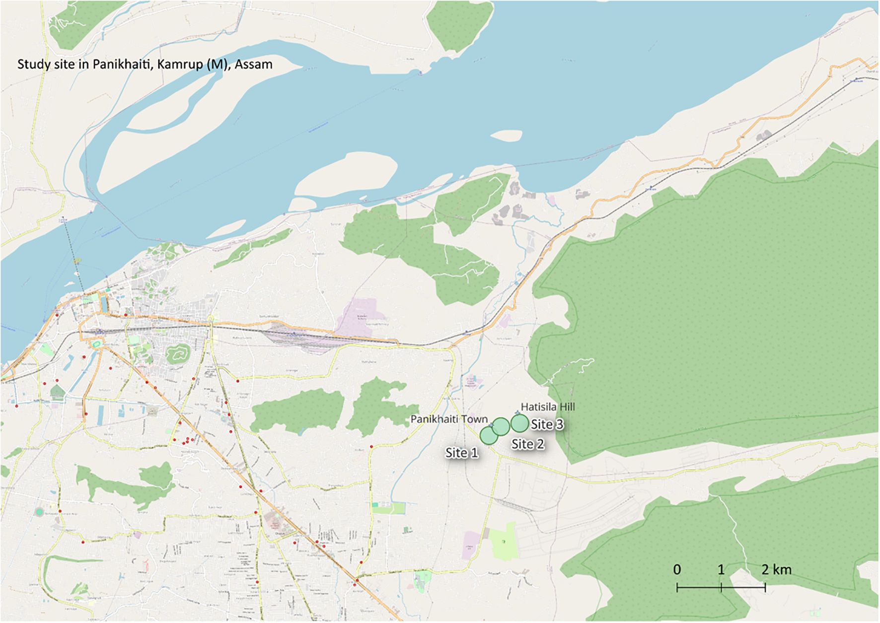 Map showing the study site in Panikhaiti, Kamrup (M), Assam. It highlights the locations of Site 1, Site 2, and Site 3 near Panikhaiti Town and Hatisila Hill. The map includes roads, green areas, and a river at the top. A scale bar indicates distances up to two kilometers.