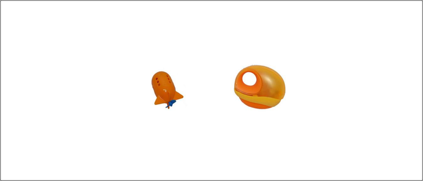 Two objects on a white background. The left object is shaped like an orange rocket. The right object is an orange object with a hole.
