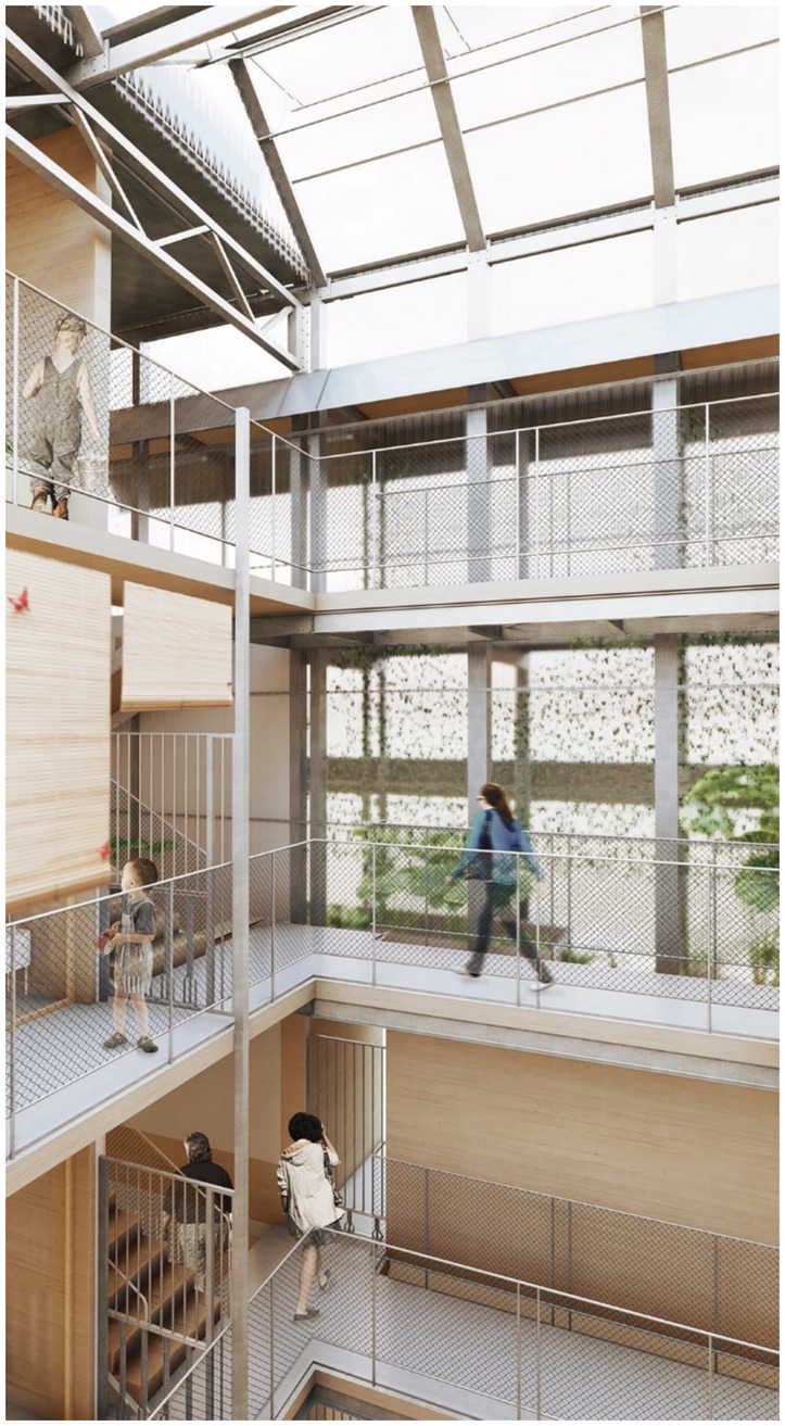 People walk on multiple levels of an airy and modern interior space with metal railings and a glass roof, providing natural light. The design includes open walkways and staircases.