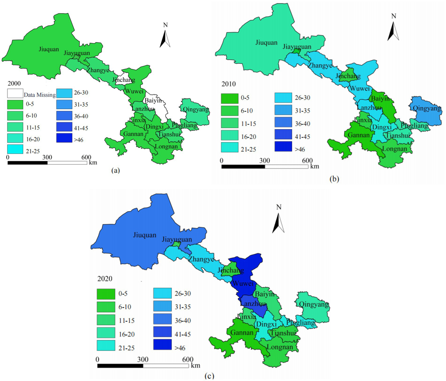 Three colored maps of Jiuquan and surrounding areas are shown for the years 2000, 2010, and 2020. Each map uses a gradient color scale representing different data ranges, from less than five to greater than forty-six, with areas marked for Jinchang, Wuwei, Lanzhou, and others. A compass indicating north and a scale bar is included in each map for reference.