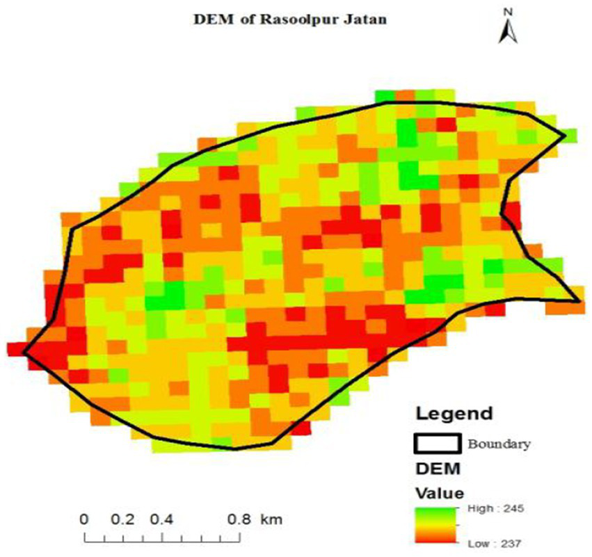 Digital elevation model (DEM) of Rasoolpur Jatan with a color gradient indicating elevation values. High areas are marked in red, while lower areas are in green. A black outline denotes the boundary. A scale of 0 to 0.8 kilometers is shown at the bottom, and a legend indicates that elevation values range from 237 to 245. A north arrow points upwards.