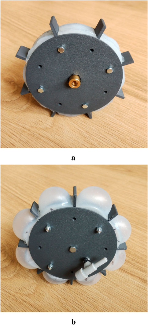 Image a shows a round object with a dark circular base and several small protrusions, with a central metal fitting, placed on a wooden surface. Image b depicts the same object turned slightly to reveal transparent spherical elements attached around the perimeter and a white nozzle-like component.