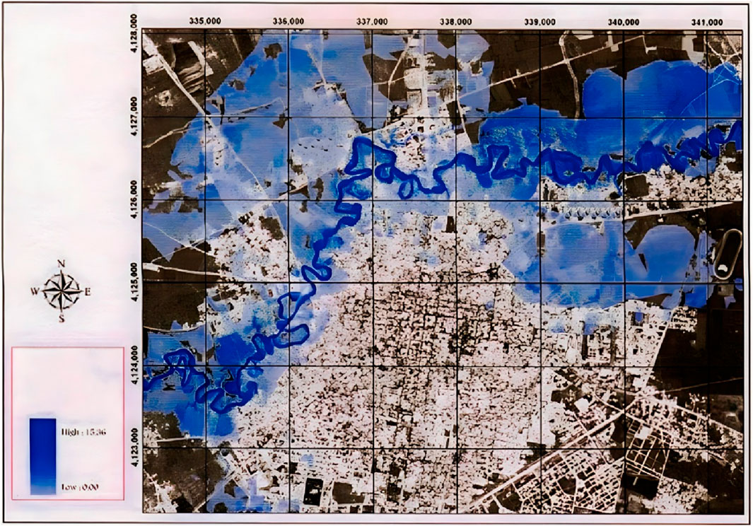 Map showing a river winding through an urban landscape, with surrounding areas shaded in various intensities of blue. A compass rose is visible on the left, along with a color scale indicating elevation from low to high.