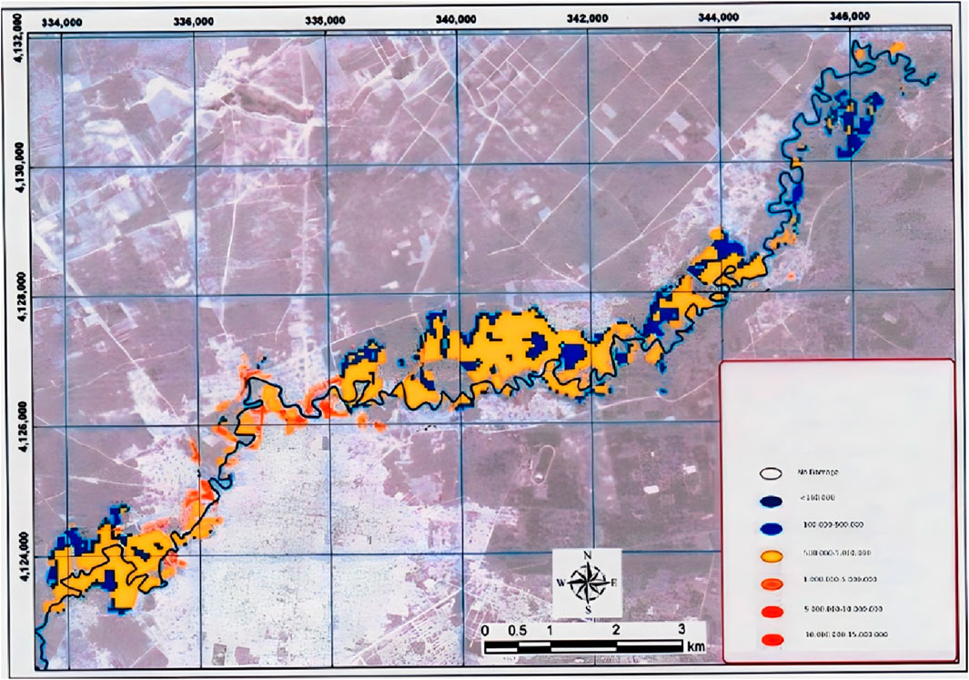 A map displays a geographical area marked with a grid and various colors indicating different data ranges. The legend shows a gradient from blue to red, representing increasing values from less than 100,000 to over 10,000,000. The map includes north, east, south, west orientation and a scale of zero to three kilometers. Geographic coordinates are marked along the edges.