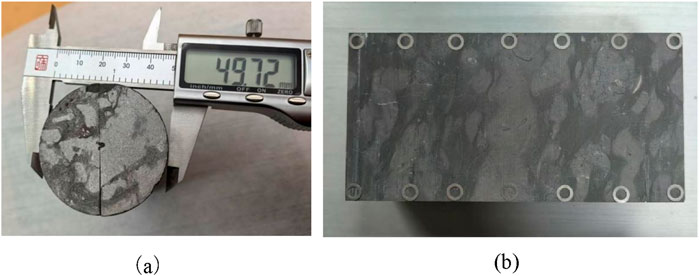 (a) Digital caliper measuring the diameter of a cylindrical object made of a composite material, shown as 49.72 millimeters. (b) Top view of the cross-section of a semi-cylindrical limestone blockCircular gaskets are laid along its edges.