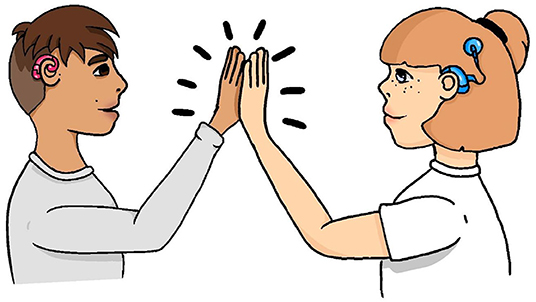 Figure 2 - The child on the left uses a red hearing aid.